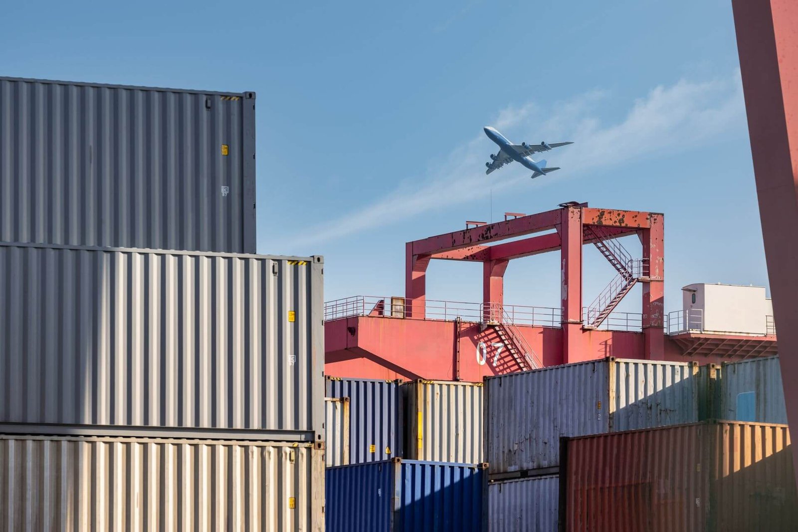 Bảo mật, an toàn, uy tín là trách nhiệm 1 container yard closeup with airplane in sky 2025 01 29 07 38 20 utc